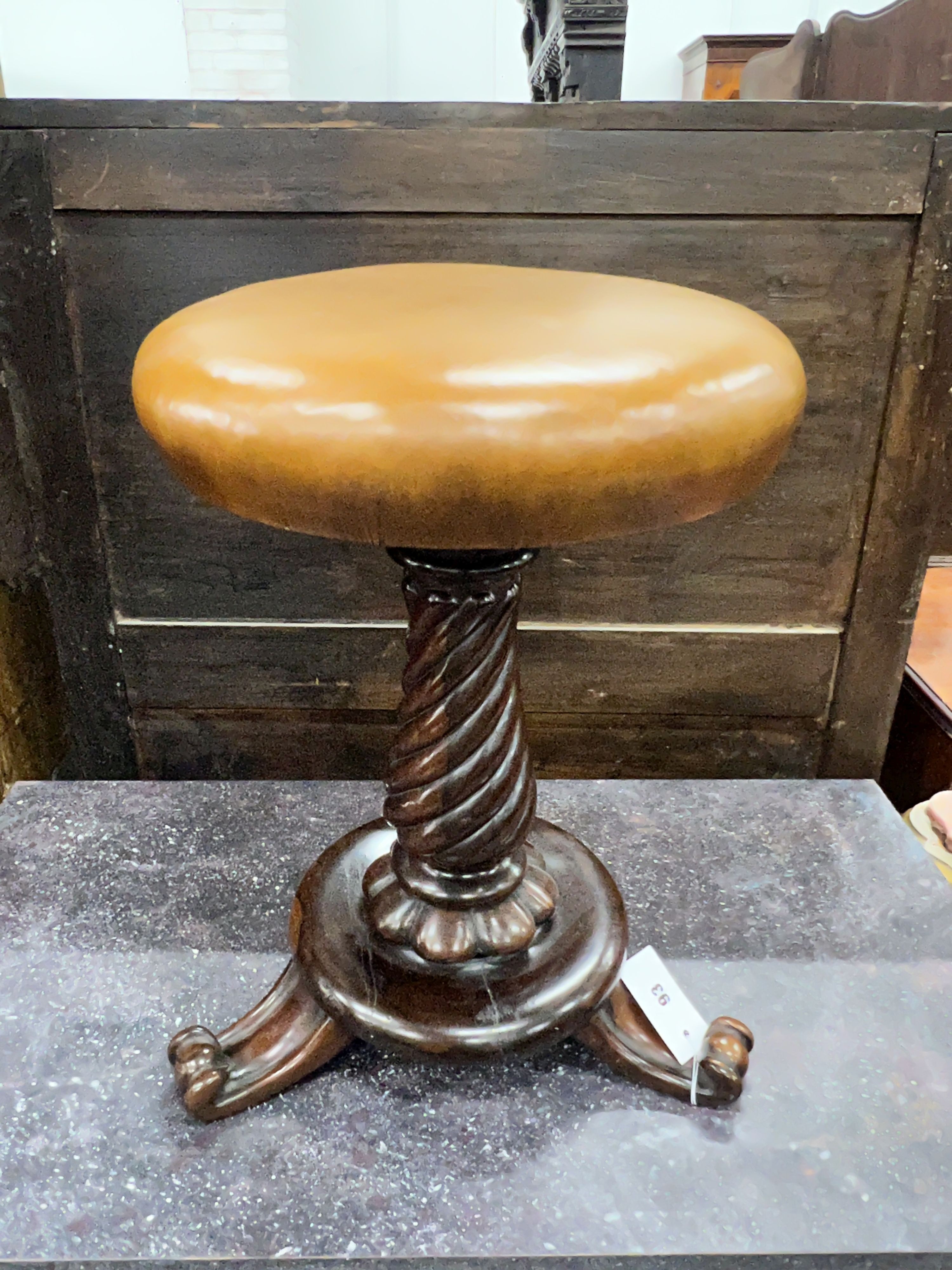 An early Victorian rosewood adjustable piano stool, mechanism a.f., height 46cm